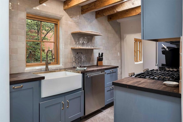 942 Canyon Unit A & B, Santa Fe, NM 87501 - kitchen with butcher block countertops, stainless steel dishwasher, backsplash, a sink, and open shelves