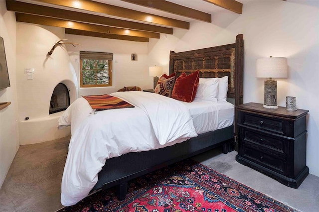 942 Canyon Unit A & B, Santa Fe, NM 87501 - carpeted bedroom with beam ceiling