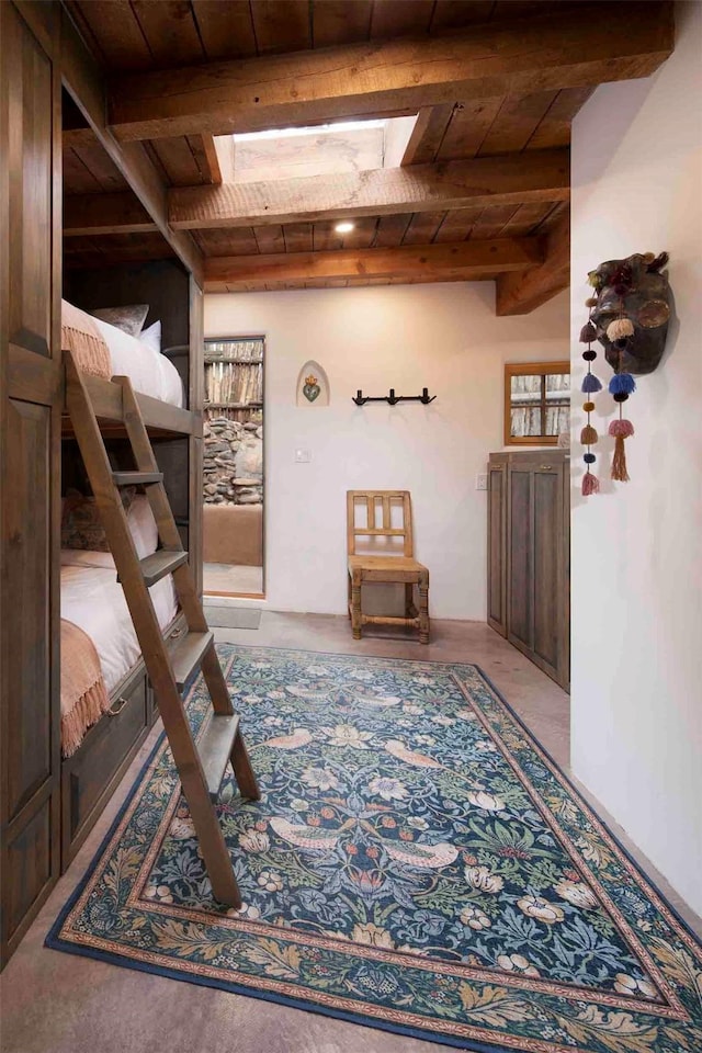 942 Canyon Unit A & B, Santa Fe, NM 87501 - bedroom featuring wood ceiling with exposed beams and a skylight