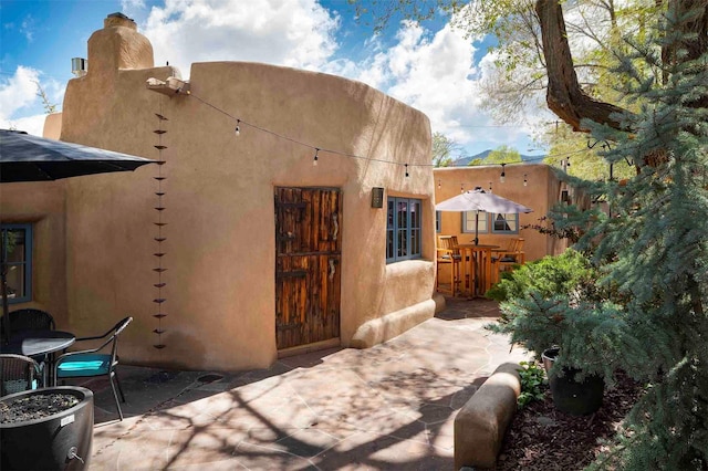 942 Canyon Unit A & B, Santa Fe, NM 87501 - rear view of property featuring a patio area and stucco siding