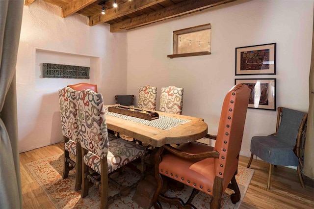 942 Canyon Unit A & B, Santa Fe, NM 87501 - dining area featuring beam ceiling, wood finished floors, and rail lighting