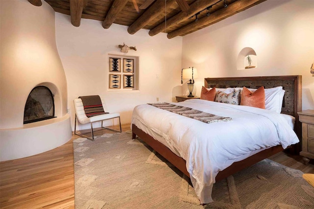 942 Canyon Unit A & B, Santa Fe, NM 87501 - bedroom featuring wooden ceiling with exposed beams and wood finished floors