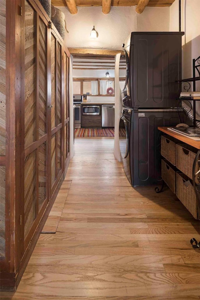 942 Canyon Unit A & B, Santa Fe, NM 87501 - laundry room featuring stacked washer / dryer and light wood-type flooring
