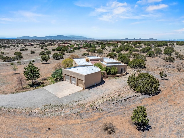 24 Camino Caballos Spur, Lamy, NM 87540 - aerial view of sparsely populated area featuring mountains and a desert landscape