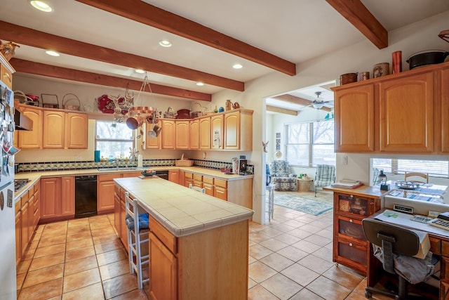 24 Camino Caballos Spur, Lamy, NM 87540 - kitchen featuring tile countertops, beam ceiling, a kitchen island, light tile patterned floors, and recessed lighting