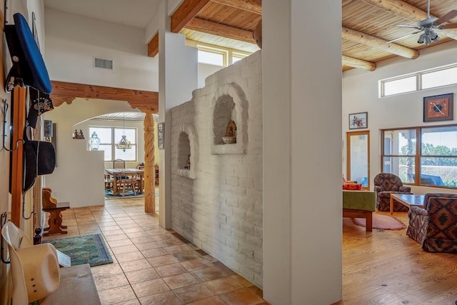 24 Camino Caballos Spur, Lamy, NM 87540 - hall with wood ceiling, beamed ceiling, healthy amount of natural light, a towering ceiling, and arched walkways