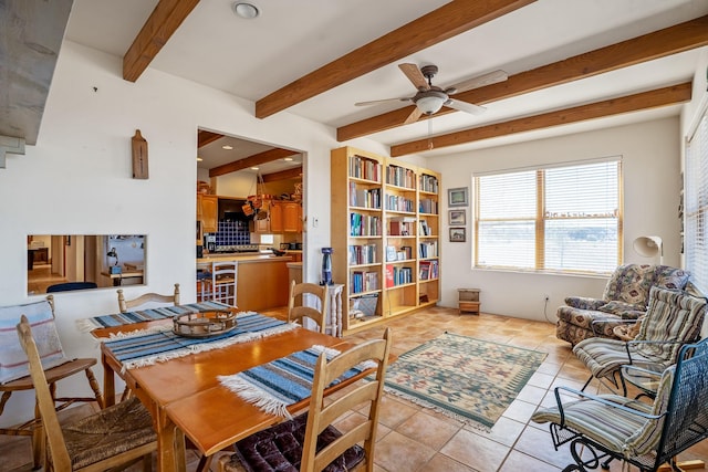 24 Camino Caballos Spur, Lamy, NM 87540 - living area with light tile patterned flooring, beam ceiling, and ceiling fan