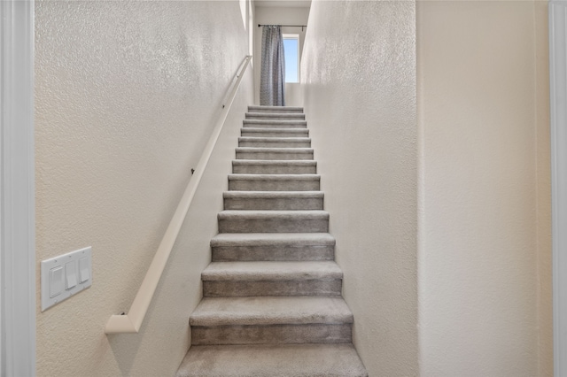 4315 Santo Domingo Unit C, Santa Fe, NM 87507 - staircase with a textured wall