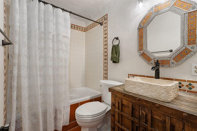 100 Rancho Alegre, Santa Fe, NM 87508 - bathroom featuring toilet, shower / bath combo with shower curtain, and vanity