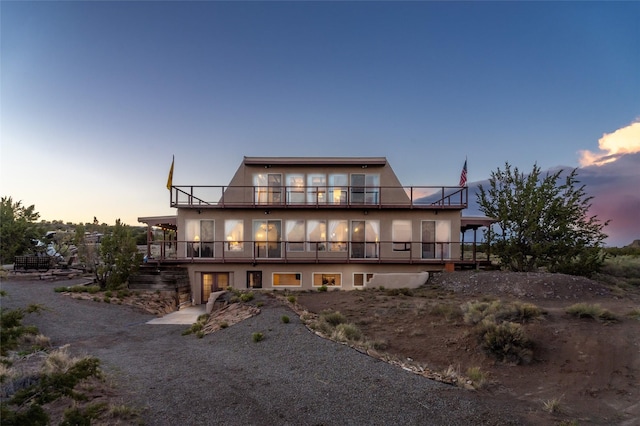 100 Rancho Alegre, Santa Fe, NM 87508 - rear view of house with stucco siding and a balcony