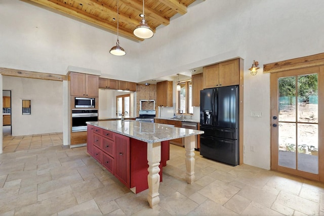 5 Camino Sin Ganas, Santa Fe, NM 87506 - kitchen featuring appliances with stainless steel finishes, wooden ceiling, a high ceiling, stone tile flooring, and plenty of natural light