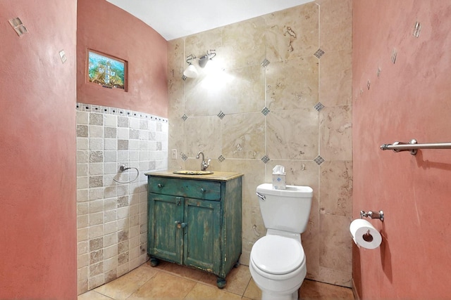 5 Camino Sin Ganas, Santa Fe, NM 87506 - bathroom with tile walls, tile patterned floors, toilet, and vanity