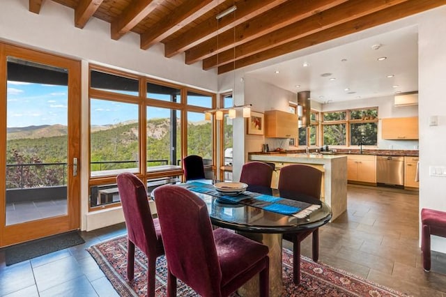 dining space with beamed ceiling, wood ceiling, recessed lighting, an AC wall unit, and a mountain view