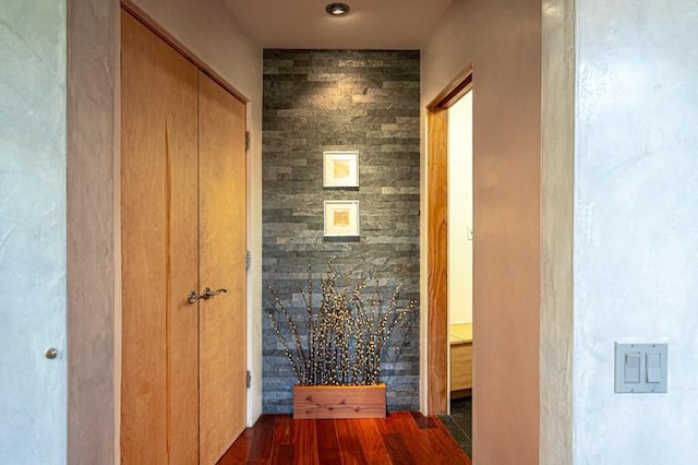 corridor with dark wood-style flooring