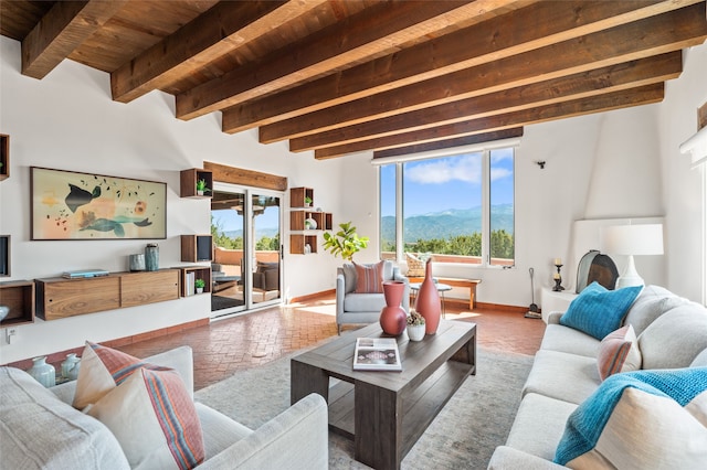 20 San Juan Ranch Rd, Santa Fe, NM 87506 - living room with wooden ceiling, beamed ceiling, a mountain view, brick floors, and baseboards