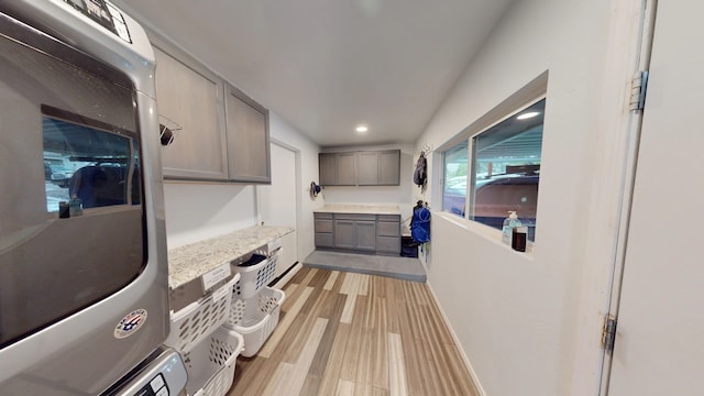 2935 Arizona, Los Alamos, NM 87544 - laundry area with cabinet space, estacked washer and dryer, light wood-style floors, and recessed lighting