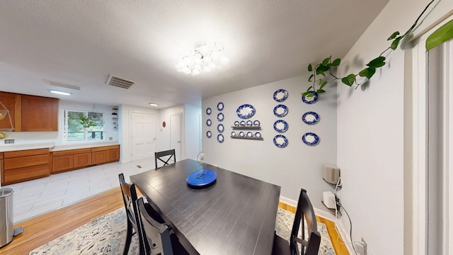 2935 Arizona, Los Alamos, NM 87544 - dining space featuring light wood-type flooring and a chandelier