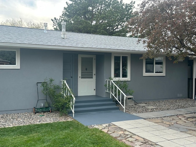 2935 Arizona, Los Alamos, NM 87544 - doorway to property featuring stucco siding and roof with shingles