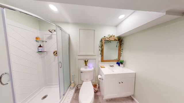 2935 Arizona, Los Alamos, NM 87544 - bathroom featuring a stall shower, vanity, recessed lighting, toilet, and baseboards