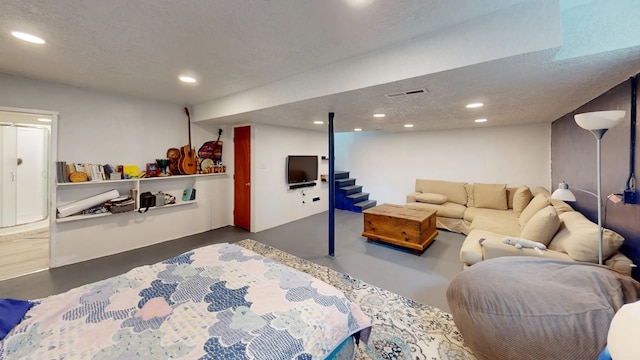 2935 Arizona, Los Alamos, NM 87544 - bedroom with finished concrete flooring, recessed lighting, and a textured ceiling
