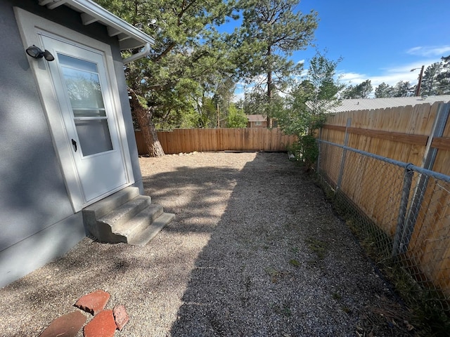 2935 Arizona, Los Alamos, NM 87544 - fenced backyard featuring entry steps