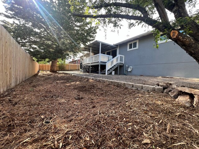 2935 Arizona, Los Alamos, NM 87544 - rear view of house featuring a fenced backyard, stairs, and a wooden deck