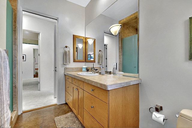 bathroom with toilet and vanity