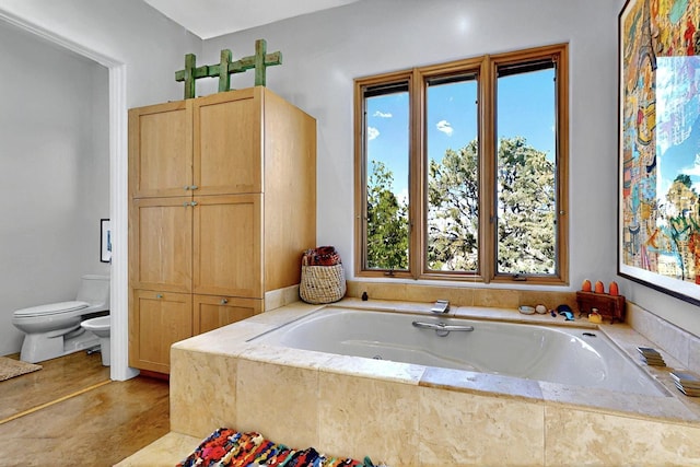 full bath with toilet, a bidet, and a garden tub