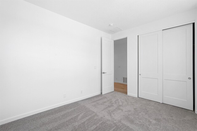 137 Mirador Blvd, Los Alamos, NM 87547 - unfurnished bedroom featuring carpet flooring, a closet, and baseboards