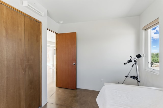 34 Ranch Rd, Lamy, NM 87540 - bedroom featuring finished concrete flooring and a closet