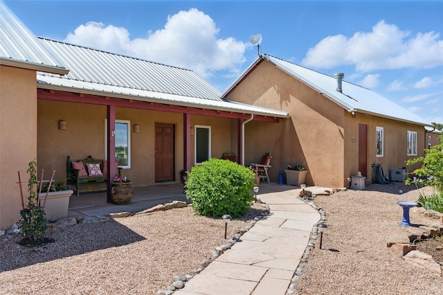 34 Ranch Rd, Lamy, NM 87540 - back of house with metal roof and stucco siding