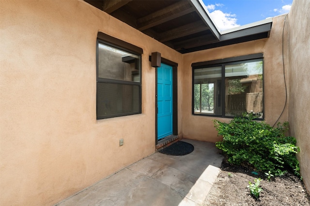 928 Los Lovatos Rd, Santa Fe, NM 87501 - entrance to property with stucco siding