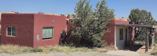 13 Los Amigos, Espanola, NM 87532 - view of home's exterior with stucco siding