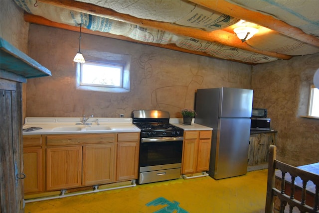 13 Los Amigos, Espanola, NM 87532 - kitchen featuring appliances with stainless steel finishes, healthy amount of natural light, light countertops, and a sink