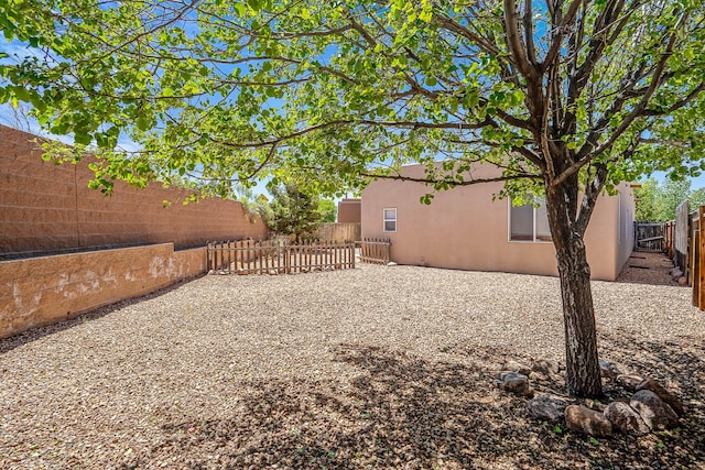 1455 Santiago Loop, Santa Fe, NM 87507 - fenced backyard featuring a patio area