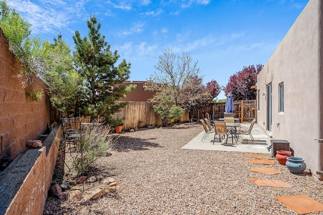 1455 Santiago Loop, Santa Fe, NM 87507 - fenced backyard with a patio