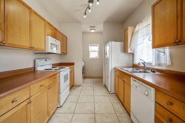 1455 Santiago Loop, Santa Fe, NM 87507 - kitchen featuring white appliances, a sink, and light tile patterned floors