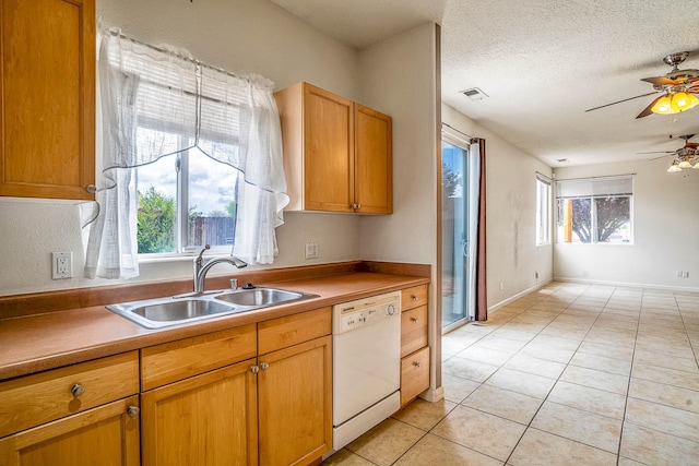 1455 Santiago Loop, Santa Fe, NM 87507 - kitchen with a sink, dishwasher, a ceiling fan, light tile patterned floors, and a textured ceiling