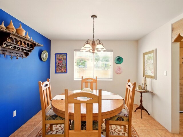 54 Encantado Loop, Santa Fe, NM 87508 - dining room featuring a chandelier and light tile patterned flooring