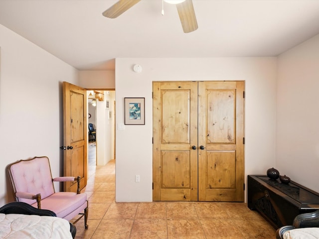54 Encantado Loop, Santa Fe, NM 87508 - sitting room with a ceiling fan and light tile patterned floors