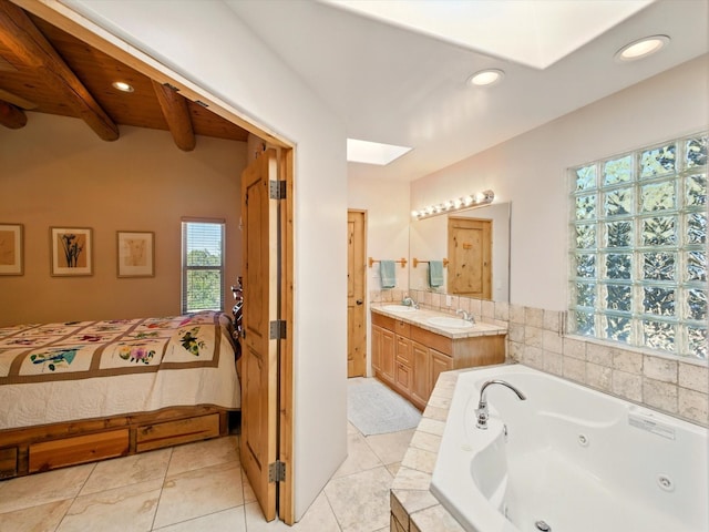 54 Encantado Loop, Santa Fe, NM 87508 - full bath featuring vanity, a tub with jets, recessed lighting, a skylight, and ensuite bath