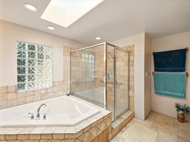 54 Encantado Loop, Santa Fe, NM 87508 - full bathroom with a skylight, a shower stall, a tub with jets, recessed lighting, and tile patterned flooring