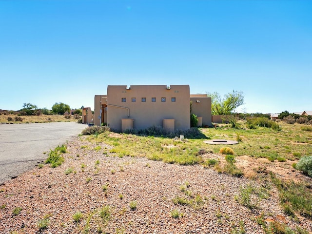 54 Encantado Loop, Santa Fe, NM 87508 - view of home's exterior with stucco siding