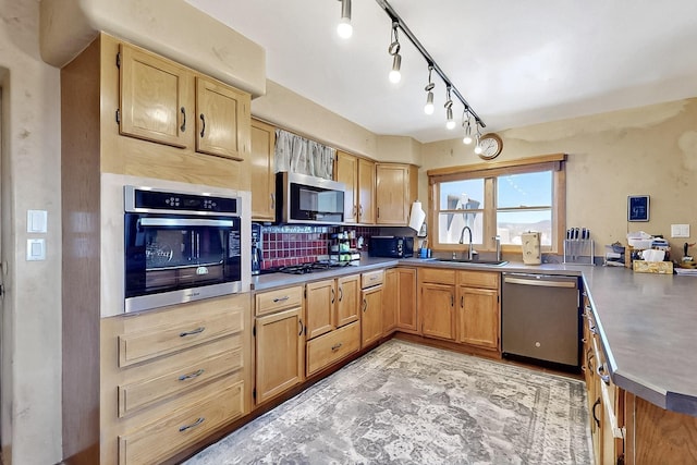 26 Apache Creek Rd, Santa Fe, NM 87505 - kitchen with stainless steel appliances, a sink, a peninsula, and tasteful backsplash