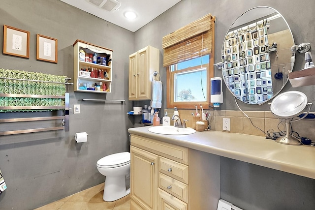 26 Apache Creek Rd, Santa Fe, NM 87505 - bathroom with tile patterned flooring, toilet, decorative backsplash, and vanity