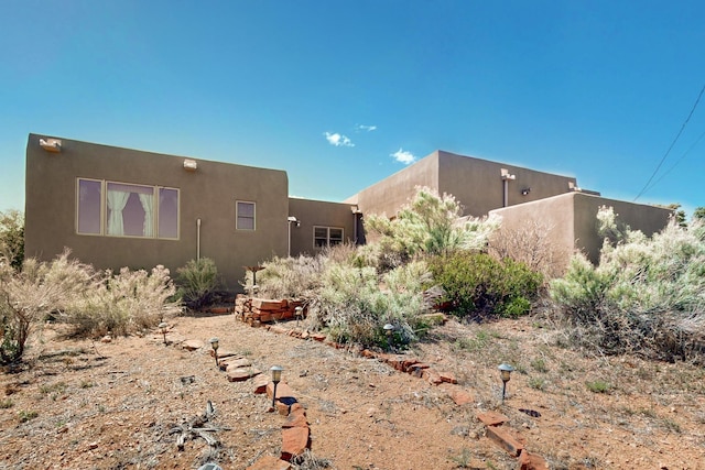 26 Apache Creek Rd, Santa Fe, NM 87505 - view of property exterior featuring stucco siding