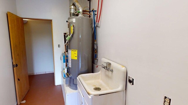 959 Acequia De Las Joyas, Santa Fe, NM 87505 - utility room with water heater and a sink