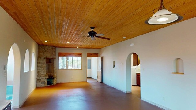 959 Acequia De Las Joyas, Santa Fe, NM 87505 - unfurnished living room with wooden ceiling, a ceiling fan, finished concrete floors, recessed lighting, and baseboards
