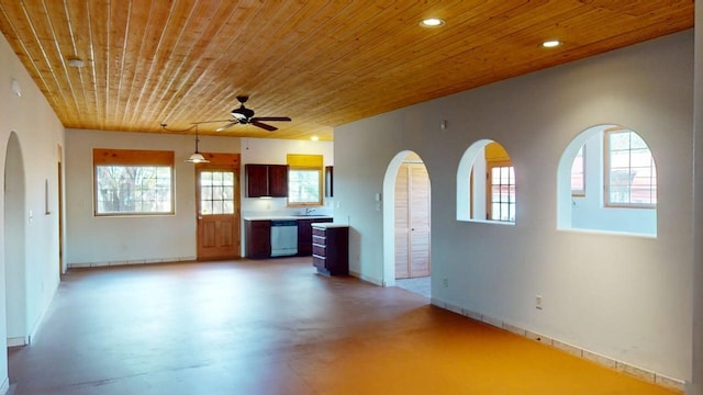 959 Acequia De Las Joyas, Santa Fe, NM 87505 - kitchen featuring stainless steel dishwasher, wood ceiling, light countertops, plenty of natural light, and ceiling fan