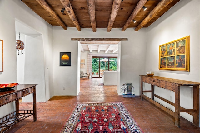 127 County Road 84, Santa Fe, NM 87506 - hall featuring wood ceiling, beam ceiling, and brick floors